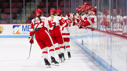 WIH celebrating goal at bench