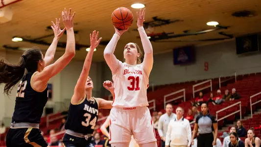 Photo of women's basketball sophomore Anastasiia Semenova going for a layup against Navy.