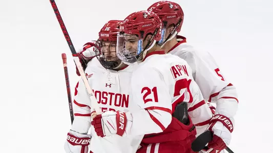 BU men's ice hockey players celebrating a goal