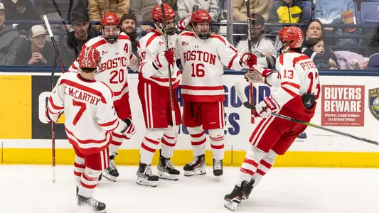 BU men's hockey players celebrate a goal at New Hampshire