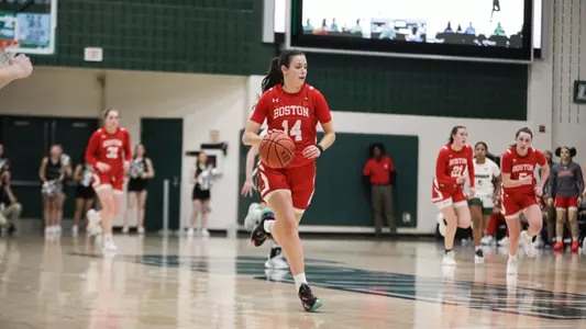 Photo of women's basketball freshman Inés Monteagudo dribbling the ball up the court against Loyola Maryland.