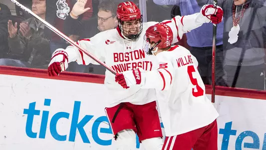 Luke Tuch celebrates his goal against UConn with Tom Willander