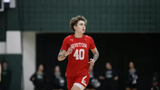 Photo of women's basketball senior Sophie Beneventine running up the court.
