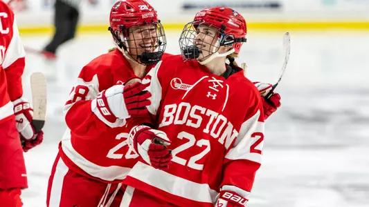 Catherine Foulem and Christina Vote celebrate after Vote scores a goal at BC