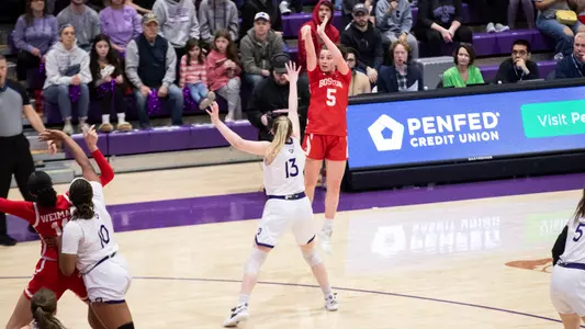Aoibhe Gormley shoots a three at Holy Cross