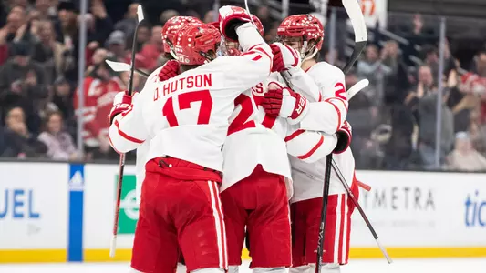 BU men's ice hockey players celebrate a goal