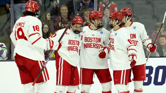 BU men's ice hockey players celebrating a gosal