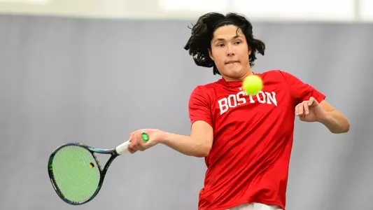 Johann Sajonz hits a wide forehand with arm outstretched