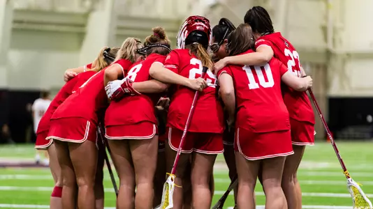 Women's Lacrosse huddles at BC