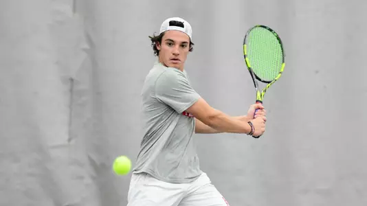 Dion Loutas pulls the racquet back in preparation for a double backhand shot
