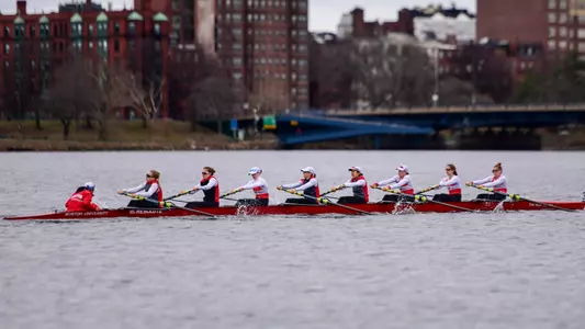 Photo of a BU Lightweight8 racing on the Charles River.