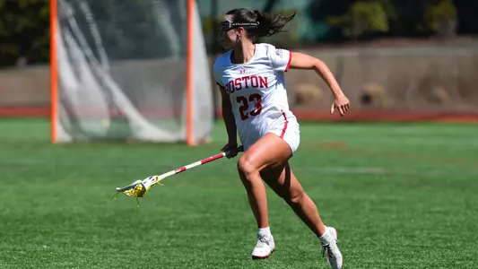 Hannah Tillier runs with the ball