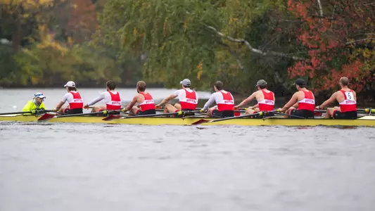 Photo of the Men's Rowing Club 8+ racing in the Head of the Charles.