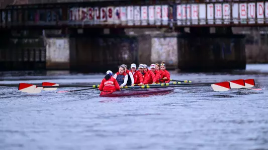Photo of a Lightweight Rowing eight recently launching off the DeWolfe Boathouse dock.