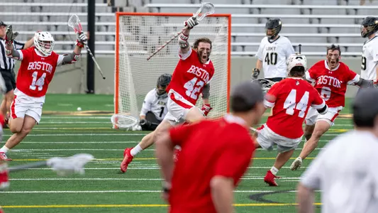 Jake Cates and his teammates celebrate after his overtime goal at Army in the 2024 PL Semifinals