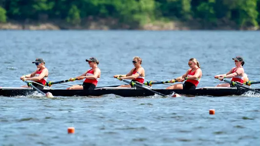 Women's Rowing eight boat races down the lake on day one of the 2024 NCAA championships