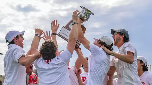 2024 BU men's tennis hoists Patriot League championship trophy in celebration