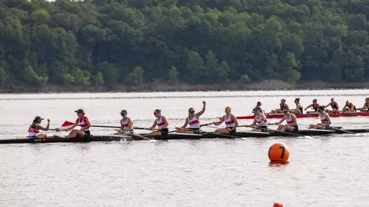 Couple of members of the women's rowing second varsity eight boat raise their fists in excitement after advancing to the C Final
