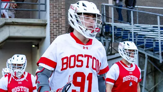 Colin Kruger walking out to the lacrosse field