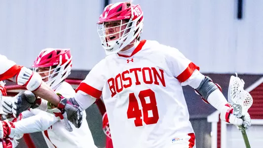 Jackson Matthews celebrating on the BU sideline