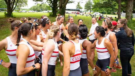 Photo of the BU Lightweight Rowing team huddling up after ending the IRA Championship.