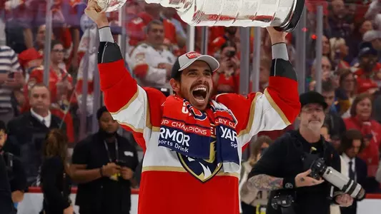 Evan Rodrigues lifting the Stanley Cup