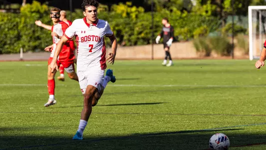 Andrea Di Blasio dribbles a soccer ball up the field at Nickerson