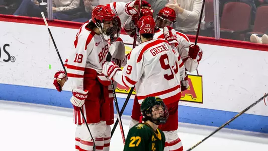 BU men's hockey players celebrate a goal against Vermont