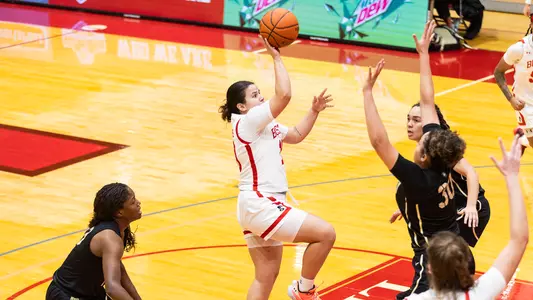 Photo of women's basketball senior Alex Giannaros shooting a floater vs. Army West Point.