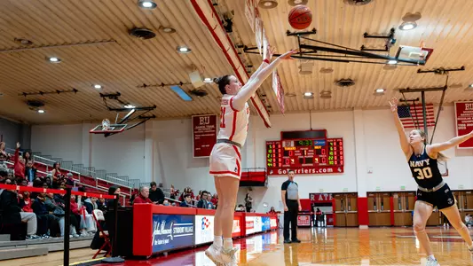 Photo of women's basketball sophomore Audrey Ericksen shooting a three-pointer at Case Gym.