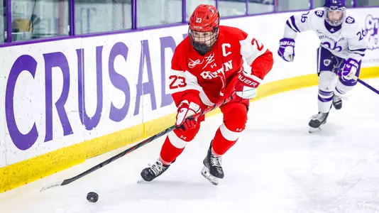 Tamara Giaquinto skates with the puck at Holy Cross