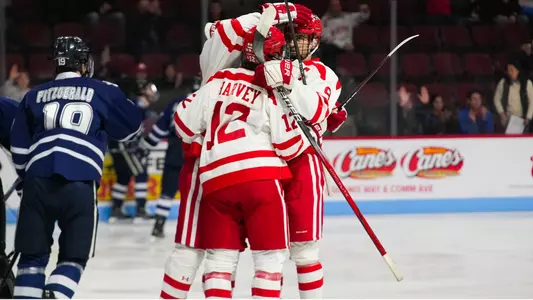 BU men's hockey players celebrate a goal against UNH