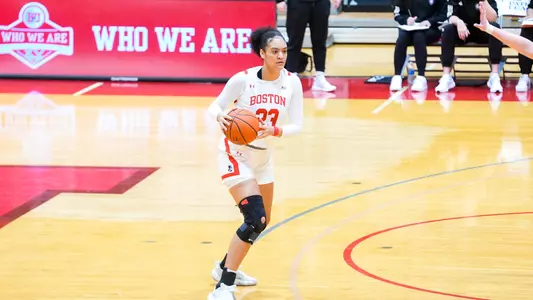 Photo of women's basketball freshman Channing Warren about to dribble the ball at Case Gym.