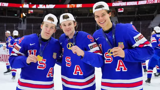Cole Eiserman, Cole Hutson and Brandon Svoboda pose together with their World Junior gold medals after the championship game