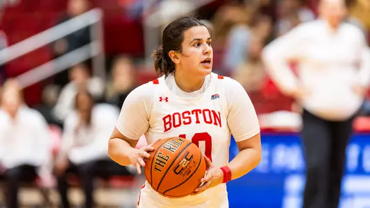 Photo of women's basketball senior Alex Giannaros holding a basketball at Case Gym.