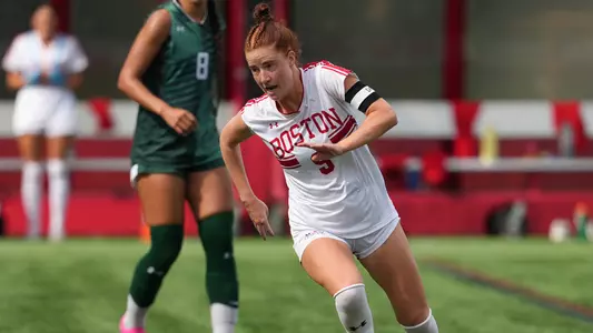 Photo of women's soccer senior Margy Porta dribbling the ball at Nickerson Field.