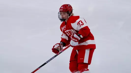 Greta Henderson playing hockey