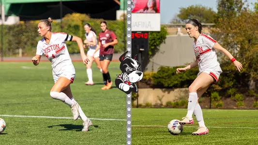 Photo of BU women's soccer senior Mackenzie Stickelman and Helene Tyburczy playing soccer at Nickerson Field.
