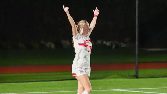 Photo of BU women's soccer junior Ava Maguire celebrating her goal vs. Holy Cross.