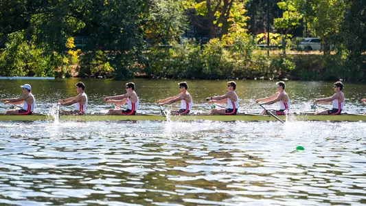 Photo of a BU Men's Rowing Club 8 racing at the Head of the Charles.