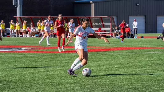 Photo of BU women's soccer senior Shayla Brown dribbling the ball at Nickerson Field.