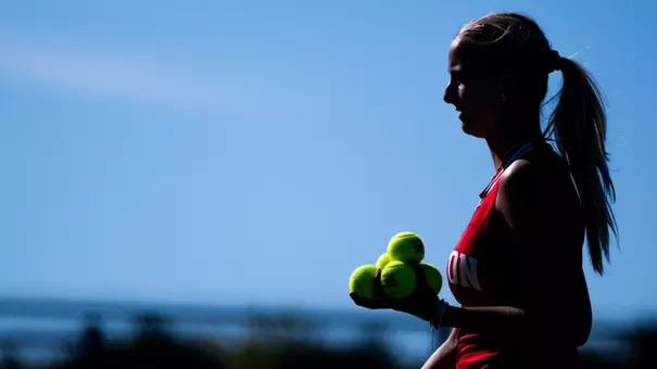 Blanka DeMicheli carrying tennis balls