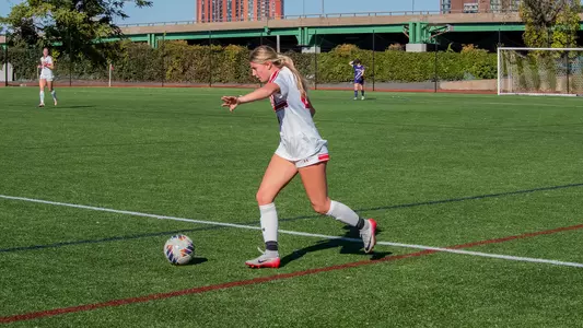 Photo of women's soccer freshman Averie Hoff about to kick the ball at Nickerson Field.