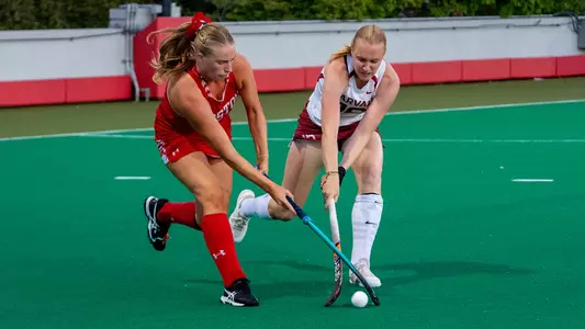Alex Purcell battles for the ball with a Harvard player