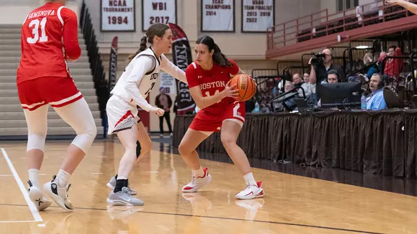 Photo of BU women's basketball junior Inés Monteagudo sizing up a Brown defender.
