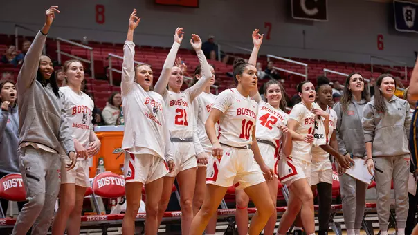 Photo of the BU Women's Basketball bench reacting to a three-pointer at Case Gym.