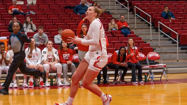 Photo of BU women's basketball senior Anete Adler about to shoot a layup at Case Gym.