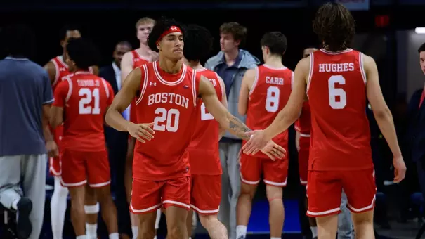 Michael McNair slaps hands with Sam Hughes