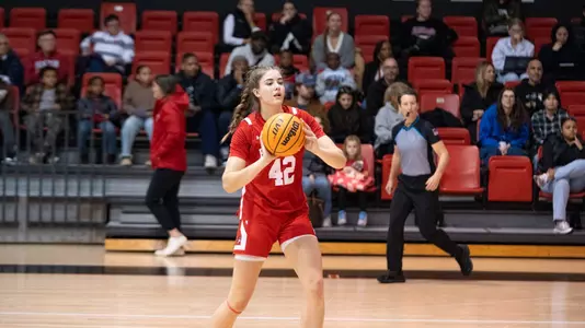 Allison Schwertner passes the ball to a teammate at Northeastern