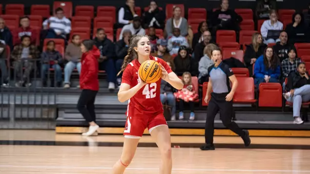 Allison Schwertner passes the ball to a teammate at Northeastern